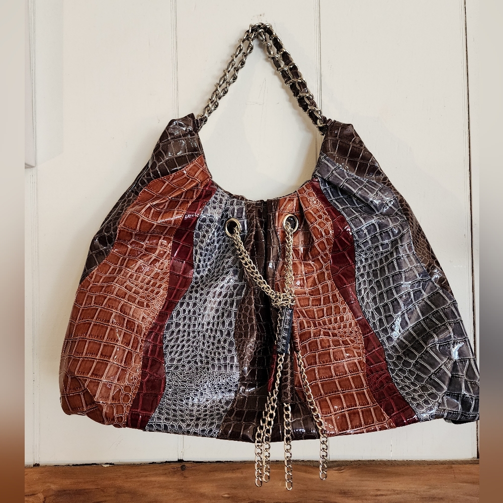 Multi color brown gray with silver tone straps & accents like new!